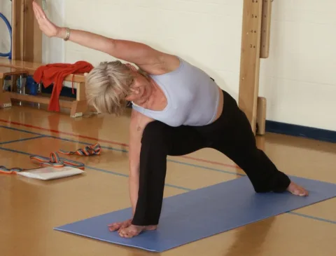 Yoga stretches - You can do yoga exercises at home alone or in a class with an instructor 