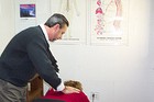 Dr. Rick Cutsinger adjusting Lynnette's spine.
