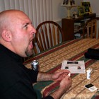 Jim sticking his finger with the poker to test his blood sugar.