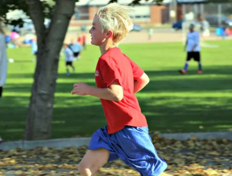 kids fitness can include heading to the park together as a family and do sprints